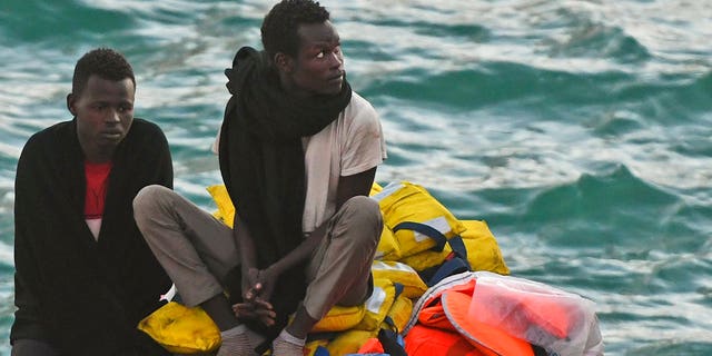 Migrants wait to be disembarked from the ship operated by German aid group Mission Lifeline, carrying 234 migrants, as it docked at the Valletta port in Malta