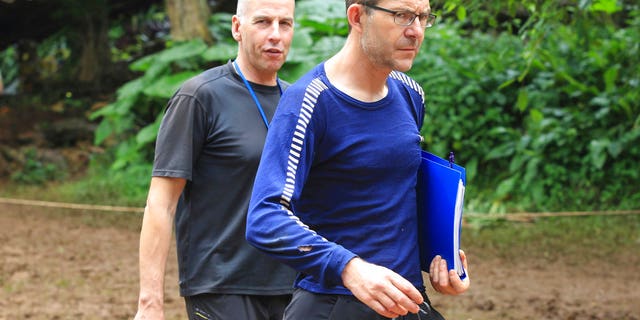 Richard Stanton, left, and John Volanthen arrive in Mae Sai, Chiang Rai province, in northern Thailand; the divers helped locate the boys 10 days after they went missing in the caves