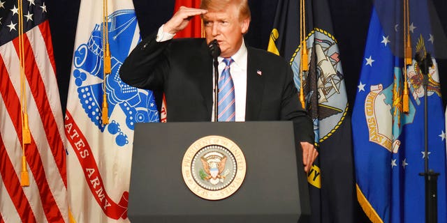 President Donald Trump speaks at a Salute to Service charity dinner in conjunction with the PGA Tour's Greenbrier Classic at the Greenbrier in White Sulphur Springs, W.Va., July 3, 2018.
