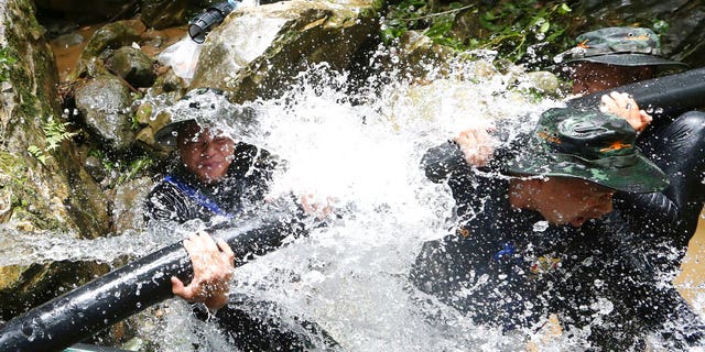 Rescuers have been working to drain the cave enough to bring the boys out.