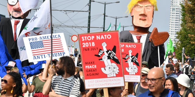 European activists are protesting President Trump's upcoming appearance at a NATO summit, marching through Brussels to plead for less military spending and more public money for schools and clean energy.