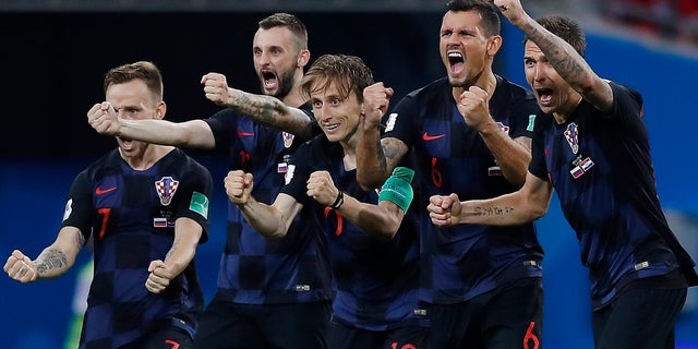 Croatia national soccer team players celebrate after a penalty is saved in a shootout during the quarterfinal match of this year's World Cup tourney. Croatia won the match 4-3.