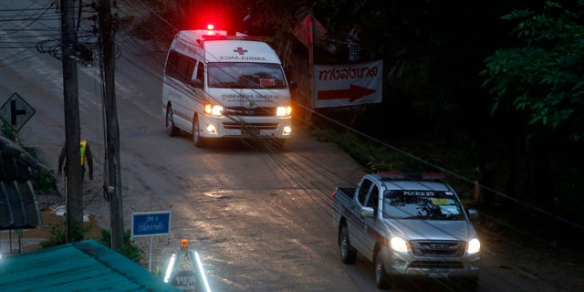 One of two ambulances leave the cave in northern Thailand hours after operation began to rescue the trapped youth soccer players and their coach.