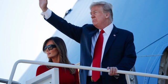 President Donald Trump and first lady Melania Trump board Air Force One, Tuesday, July 10, 2018, at Andrew Air Force Base, Md. Trump is traveling on a weeklong trip to Europe on a four-nation tour, with stops in Belgium, England, Scotland and Finland. (AP Photo/Pablo Martinez Monsivais)