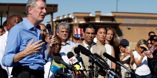 New York Mayor Bill de Blasio speaks alongside a group of other U.S. mayors during a news conference outside a holding facility for immigrant children in Tornillo, Texas.