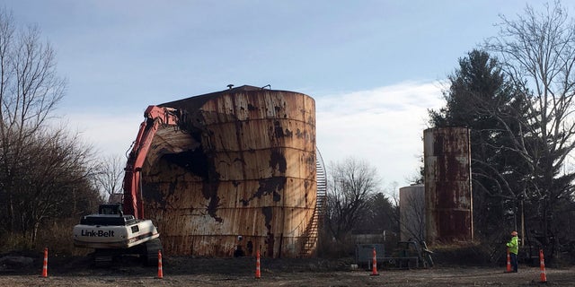 A tank at a Kiel Bros. property is torn down in Indianapolis, Dec. 11, 2017.