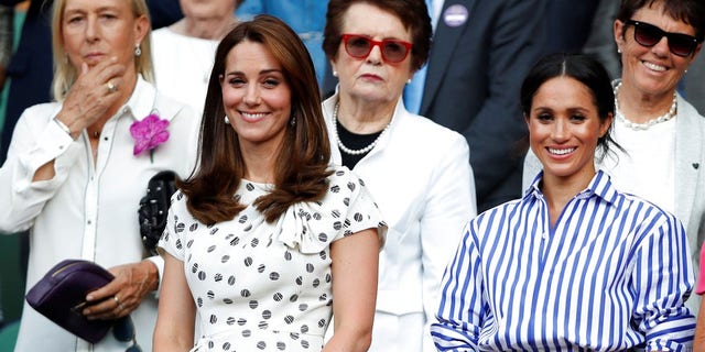 Kate, Duchess of Cambridge and Meghan, Duchess of Sussex, right, watch the women's singles final match between Serena Williams of the US and Angelique Kerber of Germany at the Wimbledon Tennis Championships, in London, Saturday July 14, 2018. (Nic Bothma, Pool via AP)