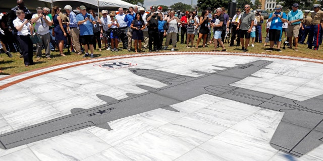 Following the service, the crowd was driven in buses to witness the unveiling of the nearby memorial, which displays an image of a KC-130T plane set in granite and surrounded in a circle by the engraved names of the fallen.
