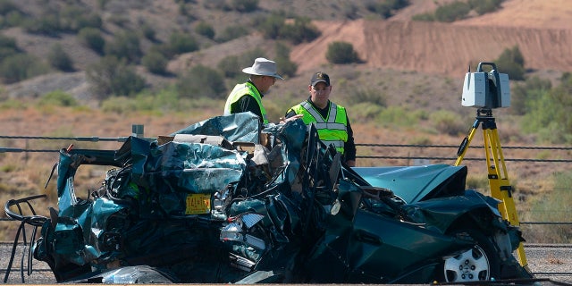 Emergency personnel work at the scene of a deadly multi-vehicle crash involving a bus that occurred on Interstate 25 just north of Bernalillo, N.M.