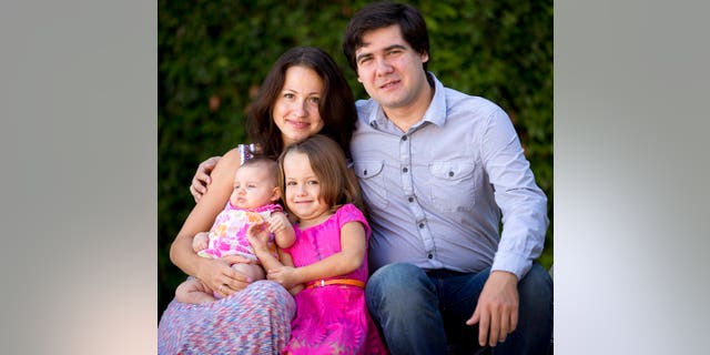 In this 2014 file photo, concert pianist Vadym Kholodenko, poses with his wife Sofya Tsygankova and daughters, Nika, center, and Michela, at their home in Fort Worth, Texas.