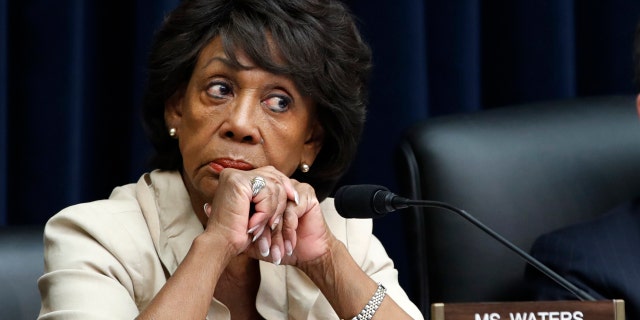 House Committee on Financial Services Ranking Member Rep. Maxine Waters, D-Calif., left, listens next to Chair Rep. Jeb Hensarling, R-Texas, during a hearing with Federal Reserve Board Chair Jerome Powell, Wednesday, July 18, 2018, on Capitol Hill in Washington. (AP Photo/Jacquelyn Martin)