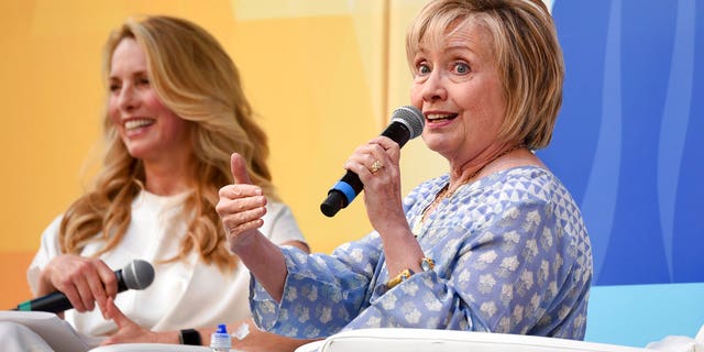 Democratic presidential candidate and former Secretary of State Hillary Rodham Clinton, right, speaks with Laurene Powell Jobs at OZY Fest in Central Park, New York City, July 21, 2018.