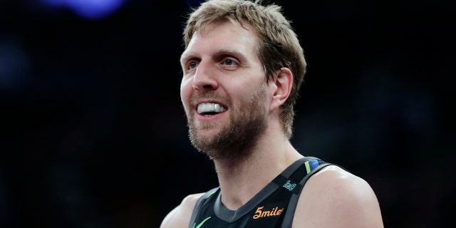 Dallas Mavericks' Dirk Nowitzki smiles during the second half of an NBA basketball game against the New York Knicks, in New York, March 13, 2018.