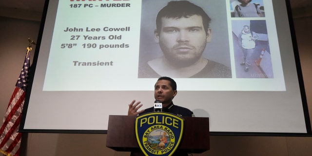 Bay Area Rapid Transit Police Chief Carlos Rojas speaks at a news conference in front of images of John Lee Cowell, a suspect wanted in the stabbings of two women at a BART station, in Oakland, Calif., Monday, July 23, 2018.