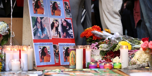 A memorial for 18-year-old Nia Wilson takes shape outside Bay Area Rapid Transit's MacArthur Station, Monday, July 23, 2018, a day after she was fatally stabbed on a platform at the station, in Oakland, Calif.