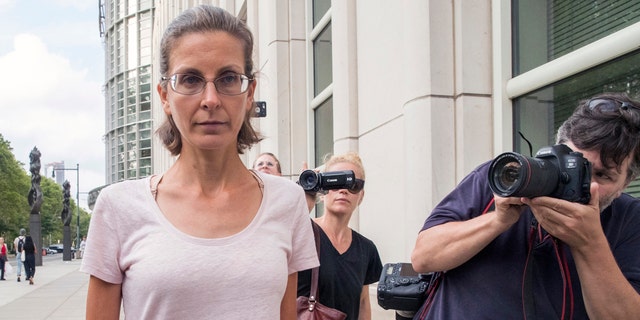 Clare Bronfman, left, leaves federal court, Tuesday, July 24, 2018, in the Brooklyn borough of New York.