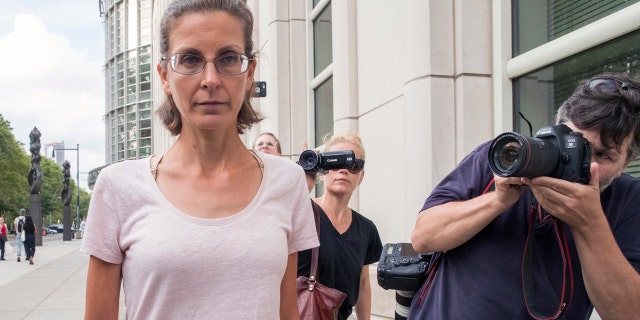 Clare Bronfman, left, leaves federal court, Tuesday, July 24, 2018, in the Brooklyn borough of New York.