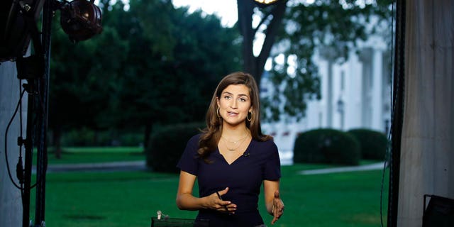 CNN White House correspondent Kaitlan Collins talks during a live shot in front of the White House, Wednesday, July 25, 2018, in Washington.