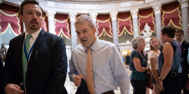 Rep. Jim Jordan, R-Ohio, walks to the House chamber as he prepares to file articles of impeachment against Deputy Attorney General Rod Rosenstein.