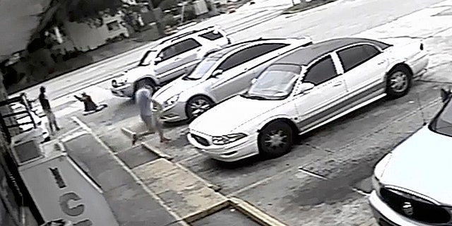 FILE - In this July 19, 2018 file frame from surveillance video released by the Pinellas County Sheriff's Office, Markeis McGlockton, far left, is shot by Michael Drejka during an altercation in the parking lot of a convenience store in Clearwater, Fla. Prosecutors charged a white man, Michael Drejka, with manslaughter Monday Aug. 13, 2018 in the death of an unarmed black man whose videotaped shooting in a store parking lot has revived debate over Floridaâs âstand your groundâ law. (Pinellas County Sheriff's Office via AP, File)