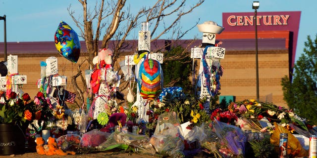 In this July 27, 2012, file photo, crosses are displayed in honor of the victims of the Aurora, Colo., movie theater shooting, which killed 12 people and injured 70.