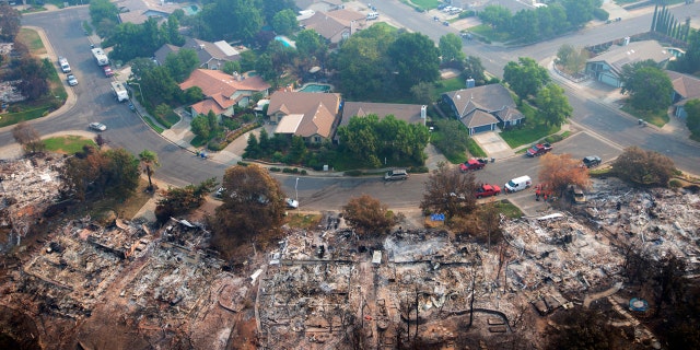 Homes destroyed by a wildfire are seen from an aerial view in the Keswick neighborhood of Redding, Calif., Friday, Aug. 10, 2018.