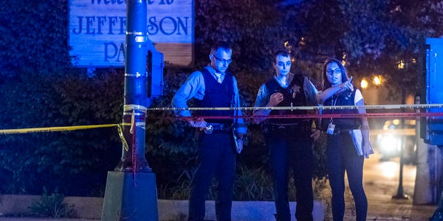 Chicago Police investigate the scene where someone was shot Sunday, Aug. 19; the weekend was the second most violent this year