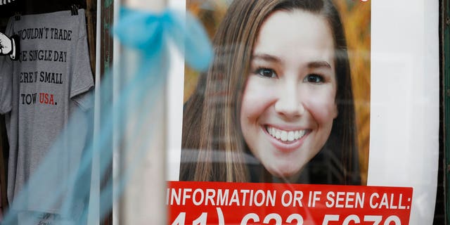 A poster for missing University of Iowa student Mollie Tibbetts hung in the window of a local business on Tuesday in Brooklyn, Iowa.