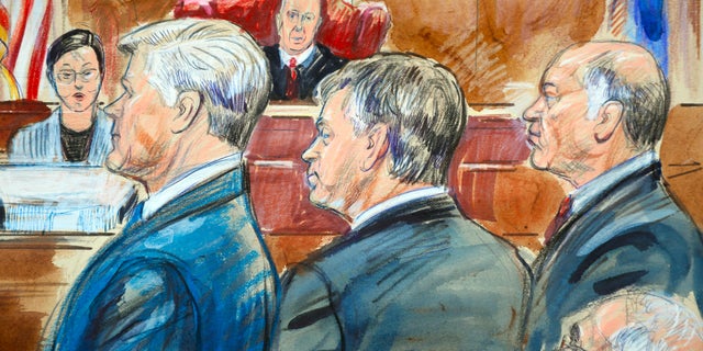 This courtroom sketch shows Paul Manafort, center, and members of his defense team including Kevin Downing, standing left, as they listen to verdicts in federal court in Manafort's the bank fraud and tax evasion trial in the courtroom of U.S. District court Judge T.S. Ellis III in Alexandria, Virginia.