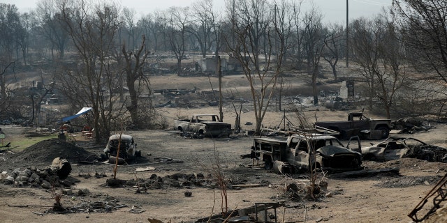 Burned out cars sit in a neighborhood burned in the Carr Fire in Redding, Calif., Aug. 11, 2018.