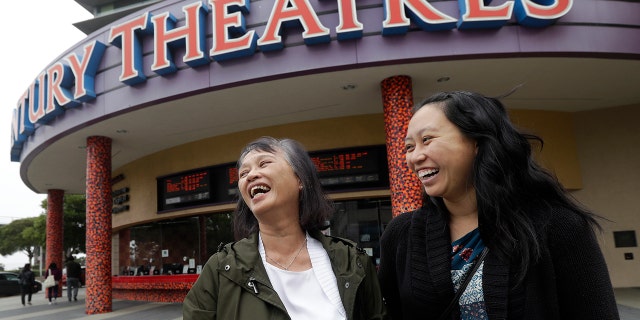 Alice Sue, left, and her daughter Audrey Sue-Matsumoto laugh while interviewed after watching the movie "Crazy Rich Asians" in Daly City, Calif., Aug. 23, 2018.