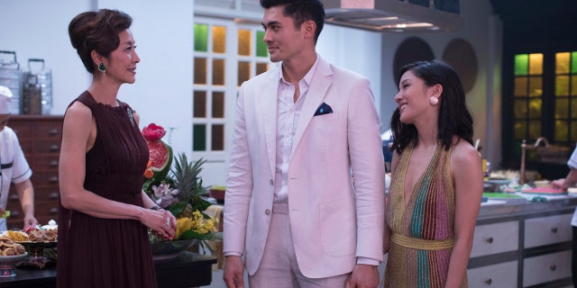 Michelle Yeoh, from left, Henry Golding and Constance Wu in a scene from the film "Crazy Rich Asians." When “Crazy Rich Asians” surpassed expectations and grabbed the top spot in its opening weekend.