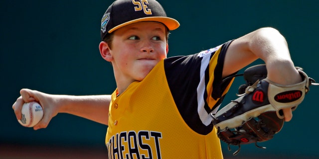 Peachtree City, Georgia's Connor Riggs-Soper delivers in the first inning of the United States Championship baseball game against Honolulu, Hawaii at the Little League World Series tournament in South Williamsport, Pa., Saturday, Aug. 25, 2018.