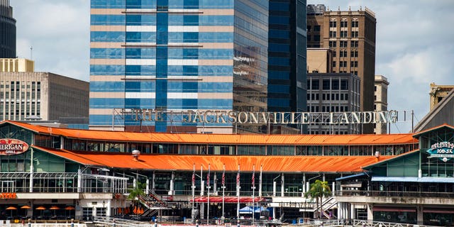 The Coast Guard patrols the St. Johns River outside The Jacksonville Landing in Jacksonville, Florida. Sources told Fox News on Sunday that at least four people were killed and 11 others were being treated after a "mass shooting" at the popular shopping mall.
