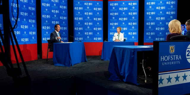 New York Gov. Andrew Cuomo and Democratic New York gubernatorial candidate Cynthia Nixon engage during a gubernatorial debate at Hofstra University in Hempstead, N.Y., Wednesday, Aug. 29, 2018.