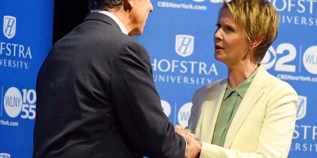 New York Gov. Andrew M. Cuomo and Cynthia Nixon shake hands at Hofstra University in Hempstead on Wednesday, Aug. 29, 2018 ahead of their the Democratic gubernatorial primary debate.