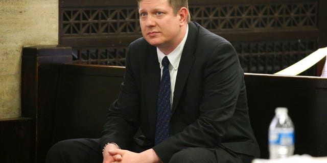 In this May 4, 2018 file photo, Chicago police Officer Jason Van Dyke attends a hearing for the shooting death of Laquan McDonald at the Leighton Criminal Court Building, in Chicago