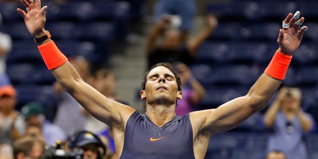 Rafael Nadal, of Spain, celebrates after defeating Dominic Thiem, of Austria, during the quarterfinals of the U.S. Open tennis tournament, early Wednesday, Sept. 5, 2018, in New York.