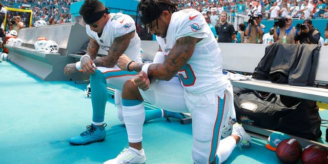 Stills, left, and Wilson protesting last week.