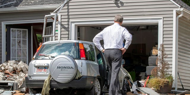 Massachusetts Gov. Charlie Baker tours the site where an 18-year-old man was killed during a gas explosion in Lawrence, Mass., Sept. 14, 2018.