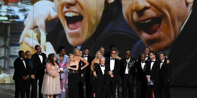 Lorne Michaels, center, and the cast and crew from "Saturday Night Live" accept the award for outstanding variety sketch series at the 70th Primetime Emmy Awards on Monday.