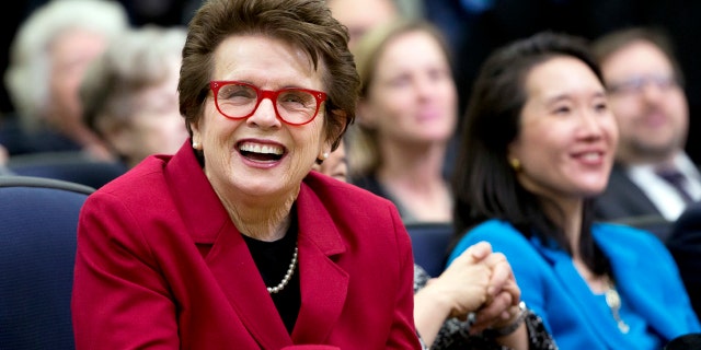 Tennis great Billie Jean King, left, laughs during an event at the Eisenhower Executive Office Building on the White House complex in Washington, Jan. 29, 2016.