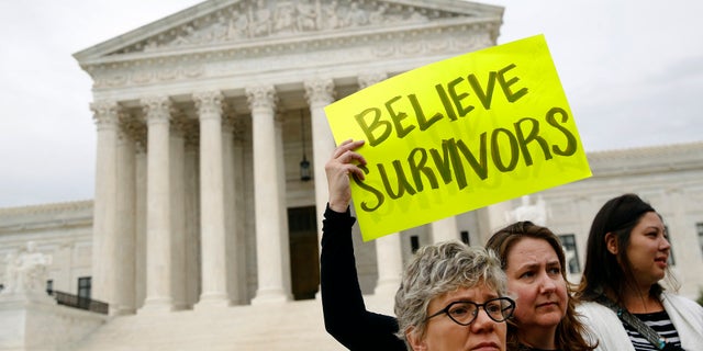 Protesters gather in front of the Supreme Court on Capitol Hill in Washington, Thursday, Sept. 27, 2018. The Senate Judiciary Committee is scheduled to hear from Supreme Court nominee Brett Kavanaugh and Christine Blasey Ford, the woman who says he sexually assaulted her.