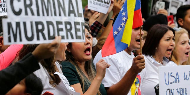 Protesters attends a rally against Venezuelan President Nicolas Maduro outside United Nations headquarters in New York