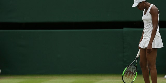 Venus Williams of the United States looks down after loosing a point against Spain's Garbine Muguruza during their Women's Singles final match on day twelve at the Wimbledon Tennis Championships in London Saturday, July 15, 2017.