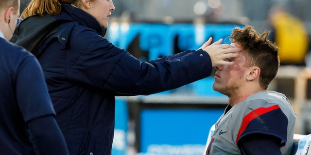 Nov. 21, 2015: In this file photo, medical staff check on Connecticut quarterback Bryant Shirreffs, right, during the first quarter of an NCAA college football game against Houston, in East Hartford, Conn.