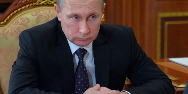 Russian President Vladimir Putin meets with Chuvashia regional leader Mikhail Ignatyev in the Kremlin in Moscow, Russia, Friday, Jan. 29, 2016. (Alexei Druzhinin/Sputnik, Kremlin Pool Photo via AP)