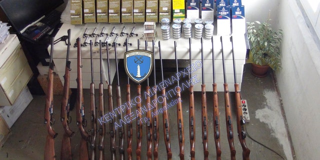This undated photo shows rifles and bullets confiscated after the arrest of two British citizens in Alexandroupolis. Following this arrest, Greek police say they arrested another man carrying four air rifles, eight scopes and 200,000 bullets.