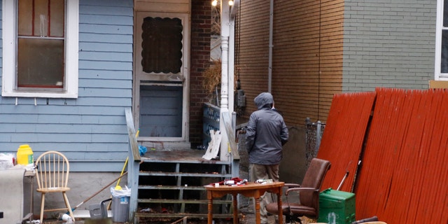 Allegheny County detectives look over the scene of a shooting on Thursday, March 10, 2016 in Wilkinsburg, Pa. Police say multiple people were killed in the shooting late Wednesday and several were injured in suburban Pittsburgh. (AP Photo/Keith Srakocic)