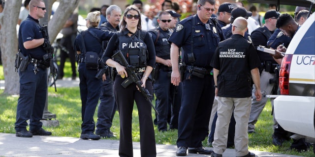 Armed officers outside the University of Central Florida campus library after reports of a person with a gun emerged.